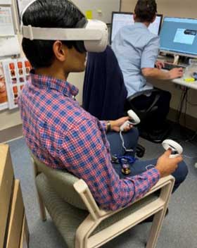 Clinician using the virtual reality training program.