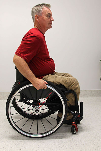 Sitting upright in wheelchair